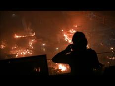 Fire at the entrance to the Hong Kong campus as protesters try to repel police