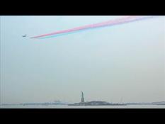 The Patrouille de France flies over the Statue of Liberty
