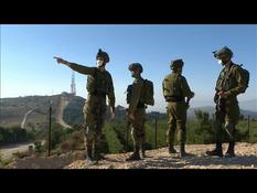 Israeli soldiers monitor the Israeli-Lebanese border