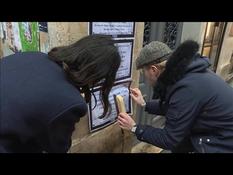 Posters on the walls of Paris to remember deported Jewish children