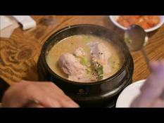 South Koreans line up for chicken soup as the hottest season begins