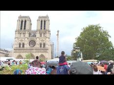 Outdoor ceremony near Notre-Dame on the eve of the Assumption