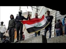 Iraqis demonstrate on Al-Rashid Street in Baghdad