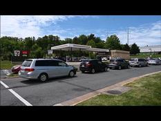 American motorists line up at a gas station