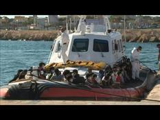 Migrants arrive in Lampedusa on Italian Coast Guard boat