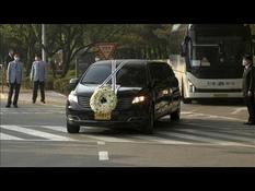 A hearse carries the body of the president of Samsung Electronics out of the funeral home